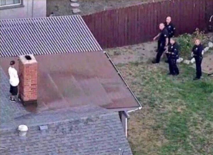 a man is seen on the roof of his house in this aerial image